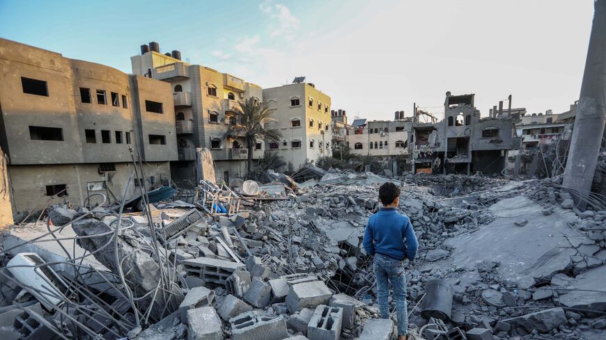 Citizens inspect the effects of the destruction of the Omar bin Abdul Aziz Mosque, and the houses adjacent to it, due to Israeli air strikes on Jan. 25, 2024 in Rafah.