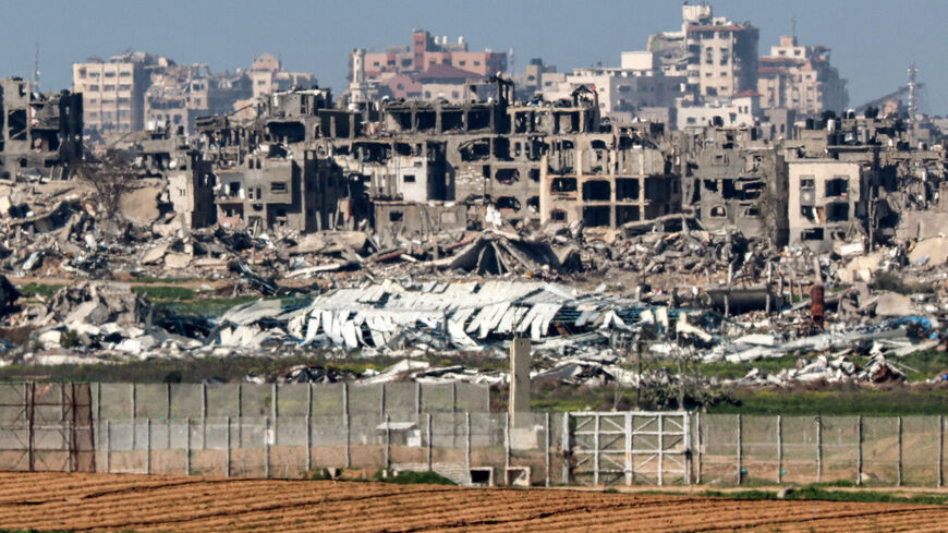 Destroyed buildings in the Gaza Strip are pictured from a position along the border with southern Israel on January 31, 2024 amid the ongoing conflict between Israel and the Palestinian militant group Hamas. (Photo by JACK GUEZ / AFP) (Photo by JACK GUEZ/AFP via Getty Images)
