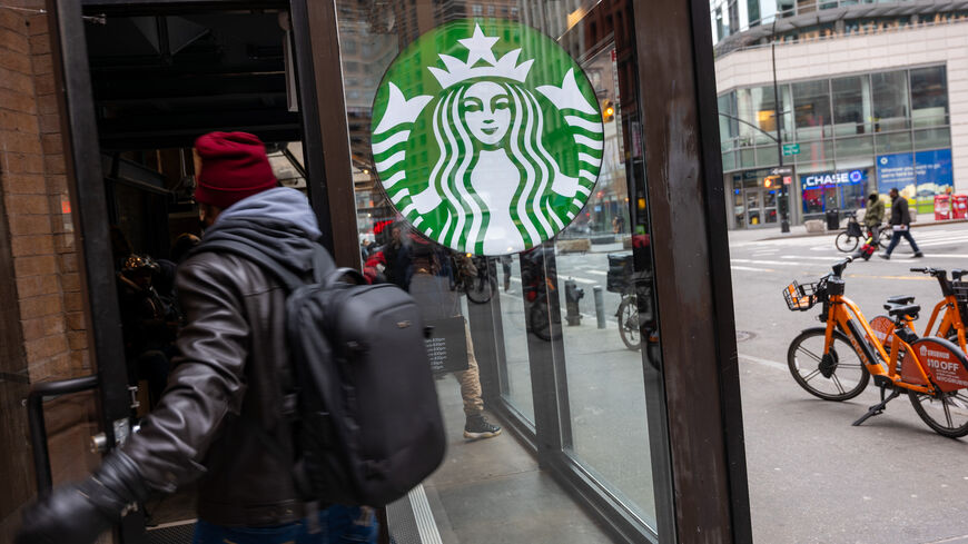 A Starbucks store stands in Manhattan on January 30, 2024 in New York City. The global coffee chain officially introduced its extra virgin olive oil-infused drinks on Tuesday. Named Oleato, the drinks debuted in Italy in February 2023 and arrive in stores on the same day Starbucks will report fourth-quarter earnings. (Photo by Spencer Platt/Getty Images)