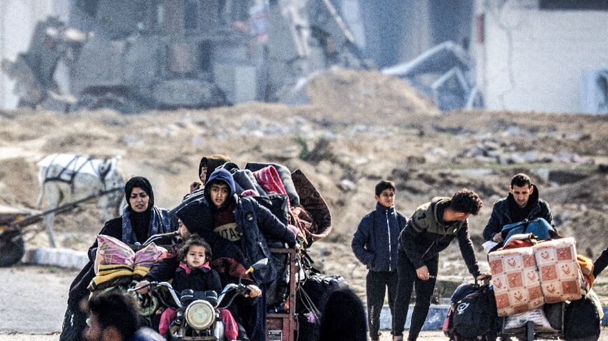 Displaced Palestinians flee from Khan Yunis in the southern Gaza Strip on January 30, 2024, amid the ongoing conflict between Israel and Hamas