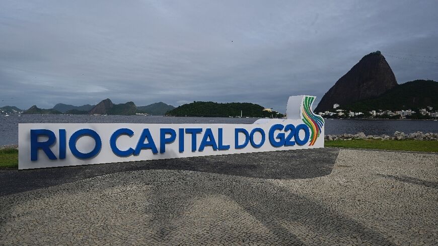 A G20 Brazil sign is seen in front of Rio de Janeiro's iconic Sugarloaf Mountain