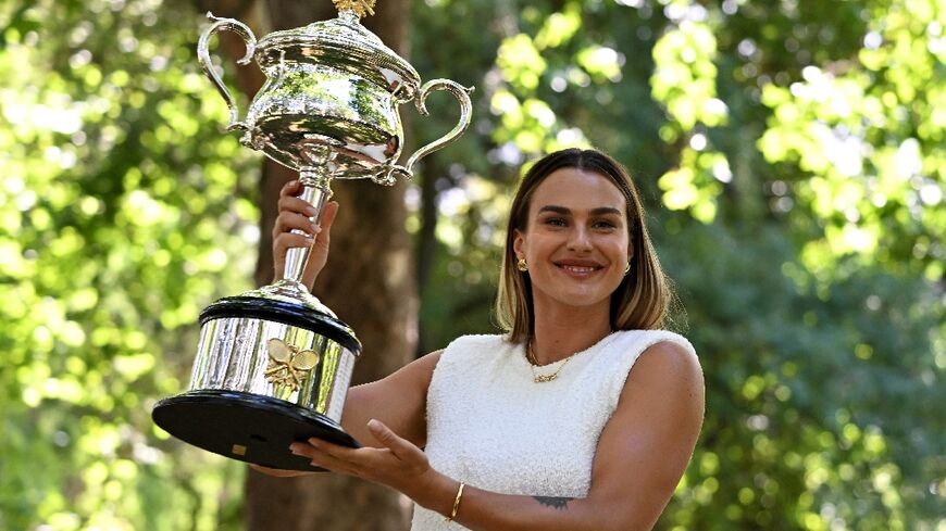Aryna Sabalenka poses with the Australian Open trophy in Melbourne - now she wants more success in Dubai