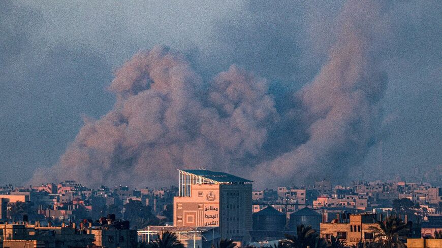 Smoke billows during Israeli bombardment of Khan Yunis, not far from Rafah
