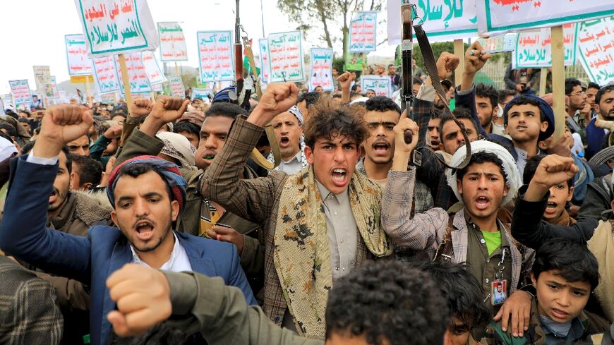 Yemenis demonstrate at a Palestinian solidarity rally in the rebel-held capital Sanaa, some of them brandishing weapons