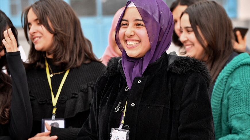 Sixteen-year-old Eya Makhloufi, in the centre, with music club members 