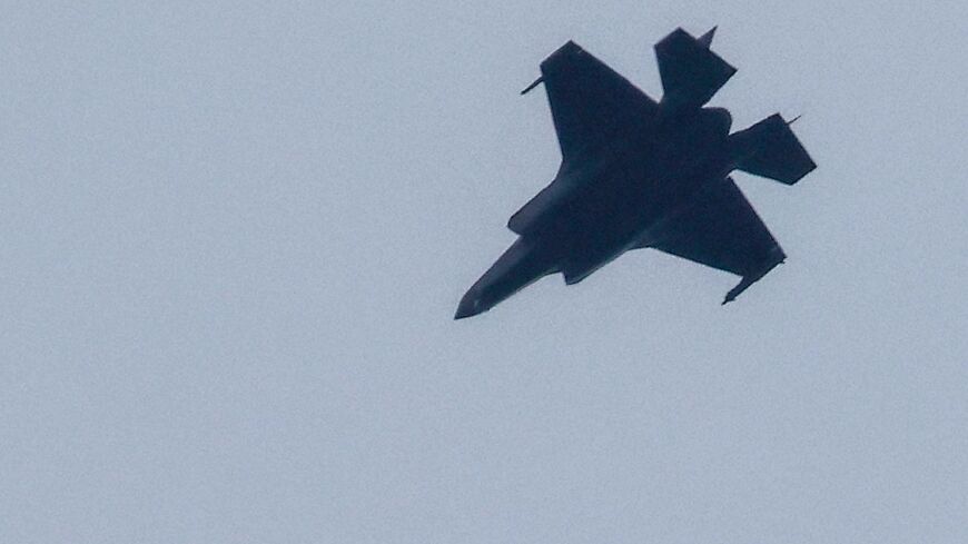 An Israeli warplane flies near the Lebanese border on February 13
