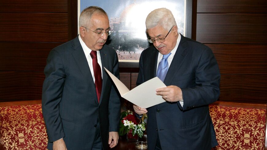 Prime Minister Dr. Salam Fayyad (L) submits his government's resignation to President Mahmoud Abbas on Feb. 14, 2011, in Ramallah, West Bank. 