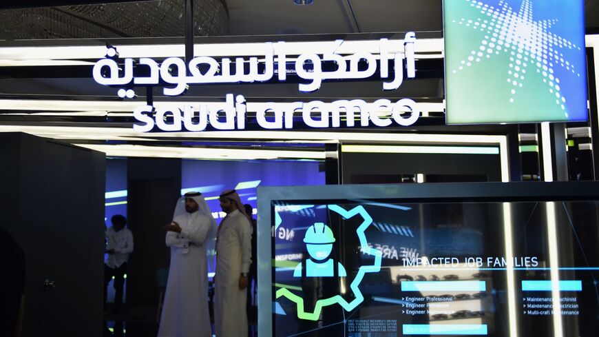 Visitors stop at the Aramco exhibition section at the Misk Global Forum on innovation and technology held in the Saudi capital Riyadh on November 13, 2019. - The Misk non-profit foundation was established by Saudi Arabia's powerful crown prince, Mohammed bin Salman to empower Saudi youths through cultivating learning and leadership. (Photo by FAYEZ NURELDINE / AFP) (Photo by FAYEZ NURELDINE/AFP via Getty Images)