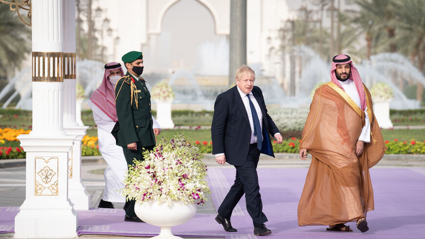 RIYADH, SAUDI ARABIA - MARCH 16: Prime Minister Boris Johnson (L) is welcomed by Mohammed bin Salman, Crown Prince of Saudi Arabia, ahead of a meeting at the Royal Court on March 16, 2022 in Riyadh, Saudi Arabia. Boris Johnson’s visit to the Middle East comes amid rocketing oil prices due to Russia’s invasion of Ukraine. He is hoping to persuade both Saudi Arabia and the UAE to increase their oil production and help bring down prices. (Photo by Stefan Rousseau - Pool/Getty Images)