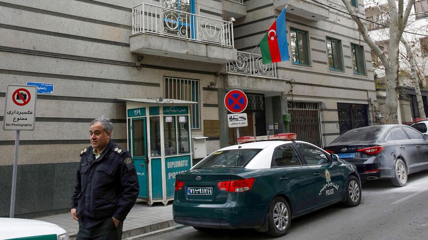 A policeman stands guard in front of the Azerbaijan embassy in Tehran on January 27, 2023, following an attack. - Azerbaijan on January 27 said it was evacuating staff from its embassy in Tehran, blaming Iran for a "terrorist" attack in which the head of security was killed and two guards wounded. (Photo by AFP) (Photo by -/AFP via Getty Images)