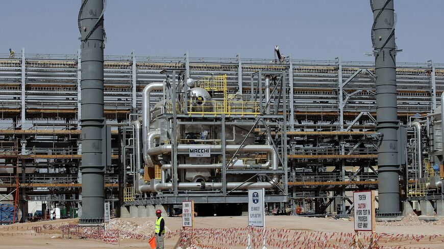 Laborers work at the construction site of Saudi Aramco's (the national oil company) Al-Khurais central oil processing facility.
