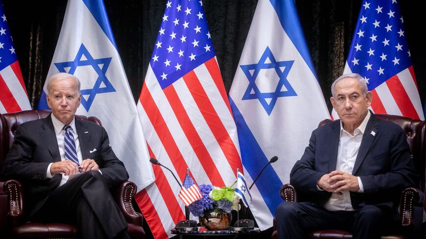 US President Joe Biden (L), sits with Israeli Prime Minister Benjamin Netanyahu, at the start of the Israeli war cabinet meeting, in Tel Aviv on Oct. 18, 2023, amid the ongoing battles between Israel and the Palestinian group Hamas. 