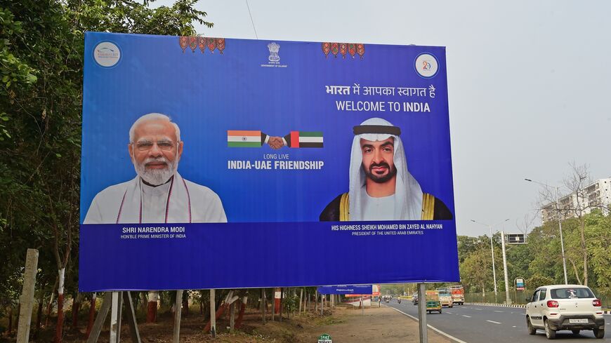 A billboard with pictures of Indian Prime Minister Narendra Modi (L) and President of the United Arab Emirates (UAE) Sheikh Mohammed bin Zayed Al Nahyan.