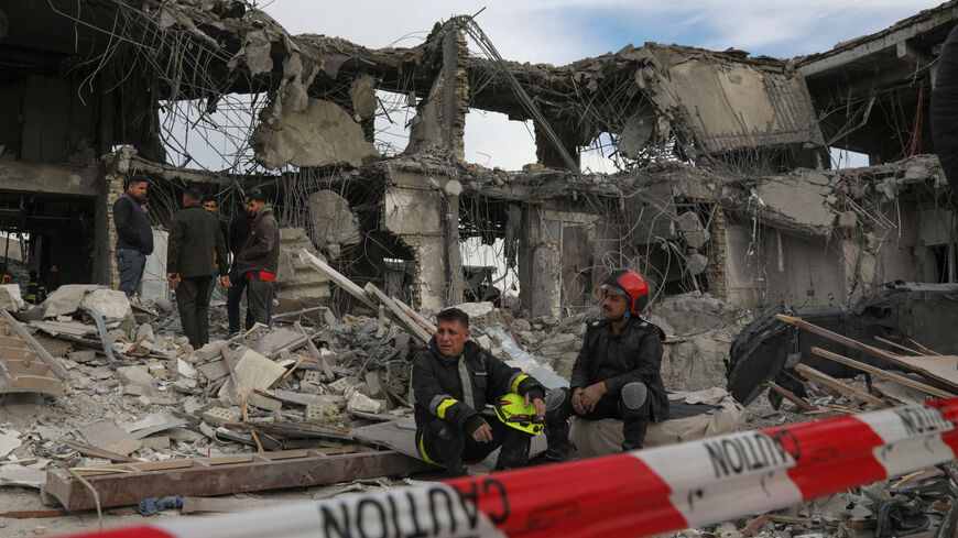 A civil defence team carries out search and rescue operations in a damaged building following a missile strike launched by Iran's Revolutionary Guard Corps (IRGC) on the Kurdistan region's capital of Arbil, on January 17, 2024. The IRGC have launched missile attacks on multiple "terrorist" targets in Syria and in Iraq's autonomous Kurdistan region, Iranian state media reported on January 16