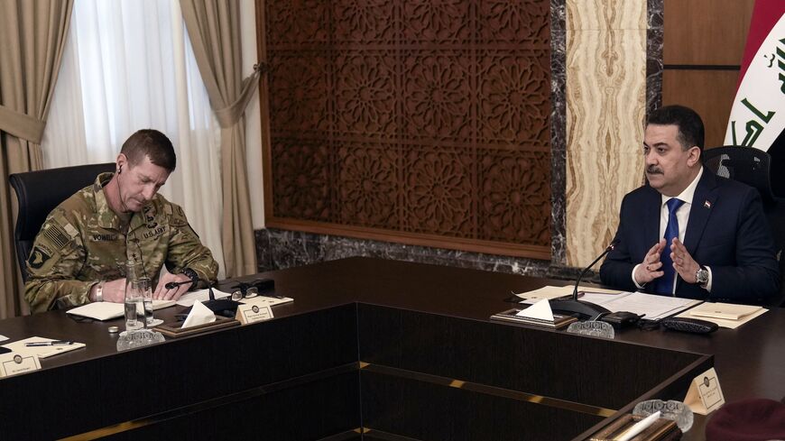 Iraqi Prime Minister Mohamed Shia al-Sudani speaks next to US Maj. Gen. Joel "J.B." Vowell as part of the first round of talks on the future of American and other foreign troops in the country, in Baghdad, on Jan. 27, 2024.