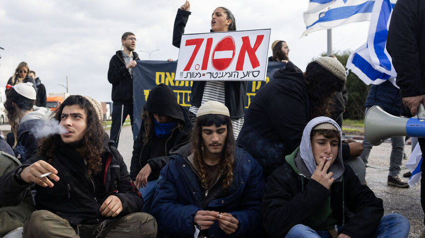 Israeli right wing activists block the exit of Ashdod port to stop trucks they claim are carrying humanitarian aid for the Gaza Strip, in the coastal city of Ashdod, on February 1, 2024, amid ongoing battles between Israel and the Palestinian militant group Hamas. (Photo by Oren ZIV / AFP) (Photo by OREN ZIV/AFP via Getty Images)