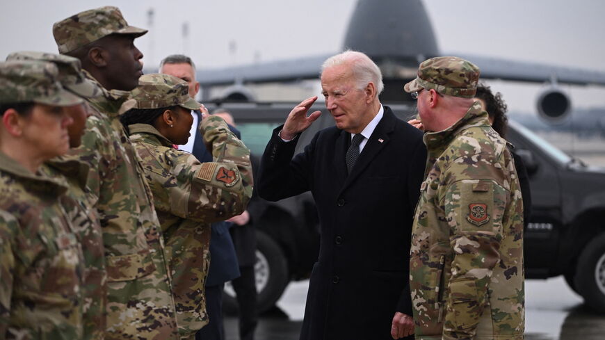 US President Joe Biden greets military personnel on arrival at Dover Air Force Base in Dover, Delaware, on Feb. 2, 2024, to attend the transfer of the remains of three US service members killed in the drone attack on the US military outpost in Jordan. 