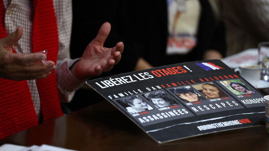 A photo shows a placard with portraits of victims during a press conference of representatives of families of French hostages in Gaza, at the Israeli Embassy in Paris, France, Feb. 6, 2024.