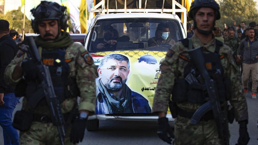A portrait of Abu Baqr al-Saadi, a prominent leader of Kataib Hezbollah killed in a strike a day earlier by a US drone in Baghdad, is plastered on a car during his funeral in Baghdad, Feb. 8, 2024.