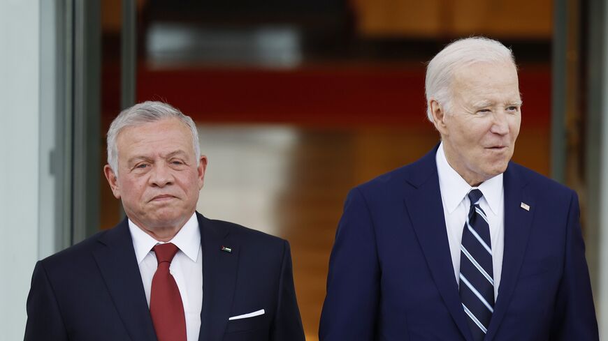 King of Jordan Abdullah II ibn Al Hussein and US President Joe Biden pose for a photo after the king's arrival on the North Portico of the White House on Feb. 12, 2024, in Washington.