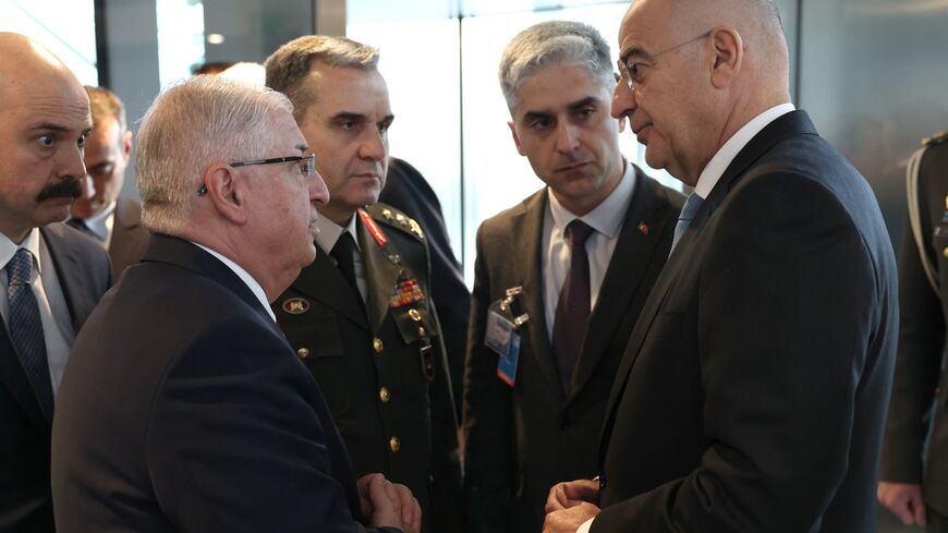 Turkish Defense Minister Yaşar Güler and his Greek counterpart, Nikos Dendias, on the sidelines of a NATO summit in Brussels Feb. 15, 2024.