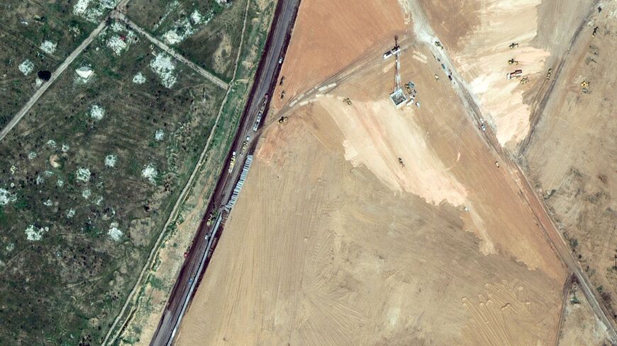 A satellite picture shows machinery building a wall along the Egypt-Gaza Strip border in Rafah, Egypt