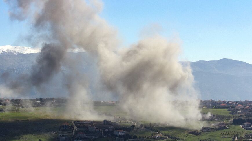 Smoke billows over the south Lebanon village of Khiam after an Israeli air strike