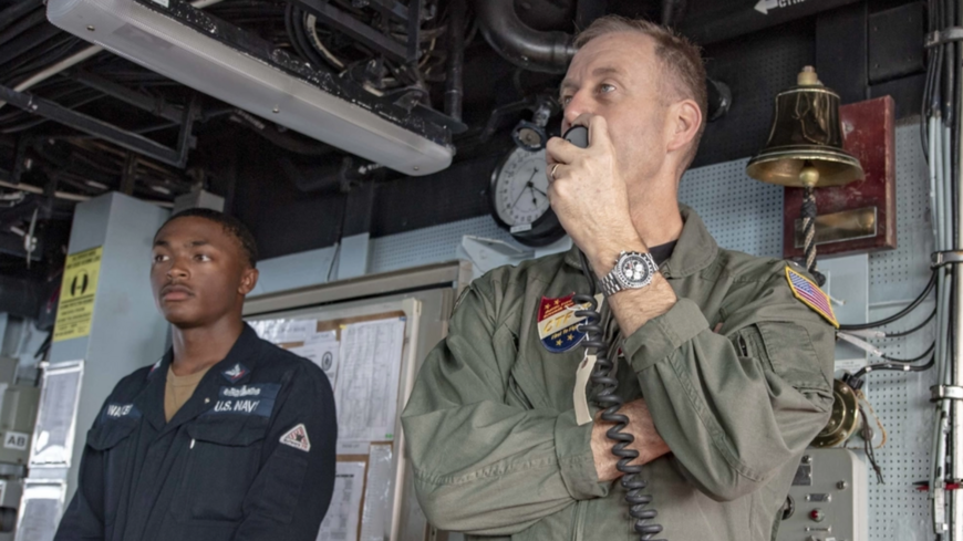 Rear Adm. George M. Wikoff, commander, Task Force (CTF) 70, speaks to the crew over the 1MC aboard the Arleigh Burke-class guided-missile destroyer USS McCampbell (DDG 85). 