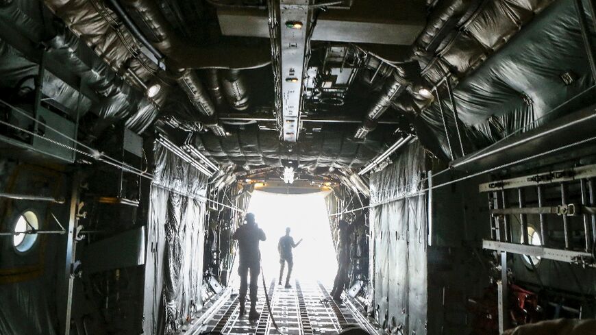 UN officials have said easing overland access into the Gaza Strip would be more effective than airdrops