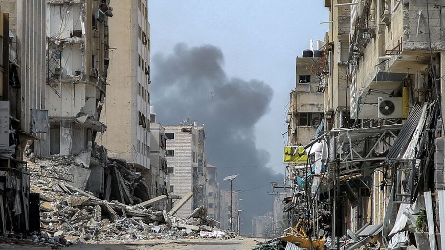 Smoke rises during an Israeli strike in the vicinity of Al-Shifa hospital in Gaza City