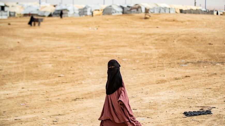 A girl walks through the al-Hol Islamic State camp in northeastern Syria