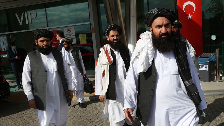 Member of the Taliban delegation Khairullah Khairkhwa (R) arrives at Ankara Esenboga Airport on Oct. 14, 2021.
