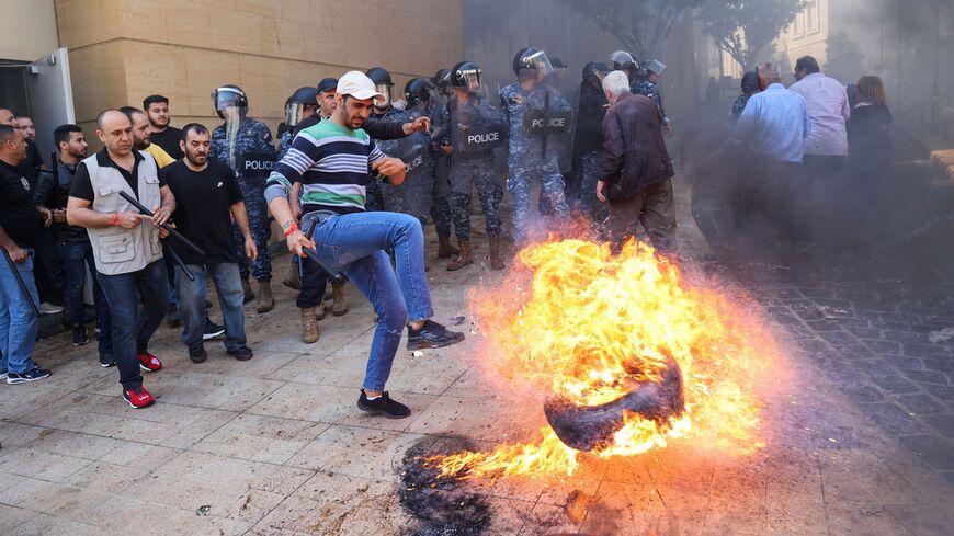 Lebanese protesters burn tyres during a demonstration called for by the banks depositors committee against monetary policies, on May 9, 2023. 