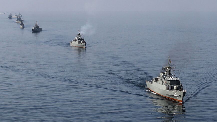 Iranian Navy boats take part in maneuvers in the Strait of Hormuz, Jan. 3, 2012.