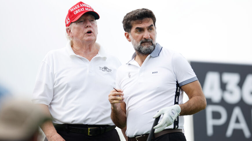 BEDMINSTER, NEW JERSEY - JULY 28: Former U.S. President Donald Trump and Yasir al-Rumayyan, head of the sovereign wealth fund of Saudi Arabia, look on from the second tee during the pro-am prior to the LIV Golf Invitational - Bedminster at Trump National Golf Club Bedminster on July 28, 2022 in Bedminster, New Jersey. (Photo by Cliff Hawkins/Getty Images)