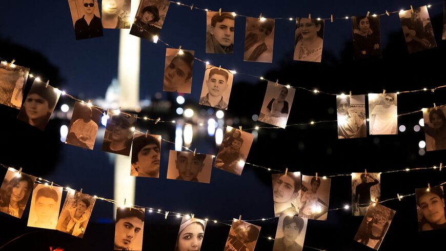 A display of photos of protesters killed during a candlelight vigil on the first anniversary of Mahsa Amini's death in Iranian custody, Washington, DC, Sept. 16, 2023