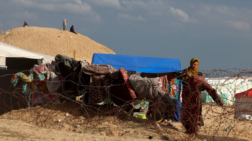 Palestinians go on with their lives at a makeshift camp set up on the beach for people who fled to Rafah in the southern Gaza Strip, amid the ongoing conflict between Israel and the Palestinian militant group Hamas, on Feb. 1, 2024.