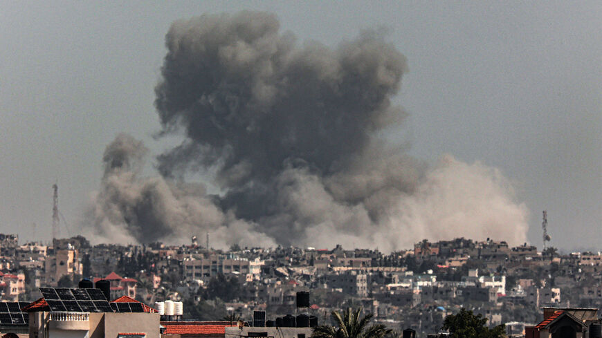 A picture taken from Rafah shows smoke billowing after Israeli bombardment on Khan Yunis in the southern Gaza Strip on March 21, 2024, amid ongoing battles between Israel and the Palestinian militant group Hamas.
