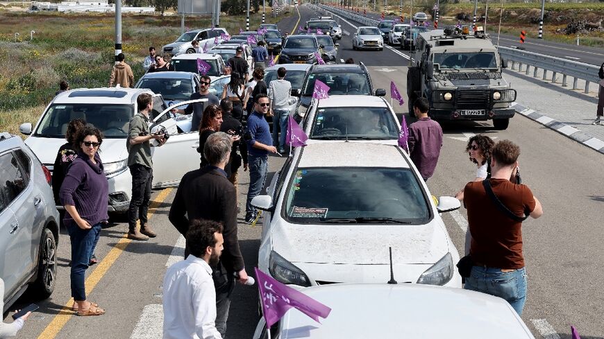 A convoy of 30 vehicles driven by Israeli activists from the 'Standing Together' movement gathers in the Israeli city of Ashkelon near the Gaza border in a show of support for Palestinians