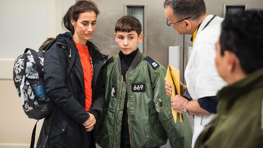 Eitan Yahalomi (R) was reunited with his mother after 52 days in captivity