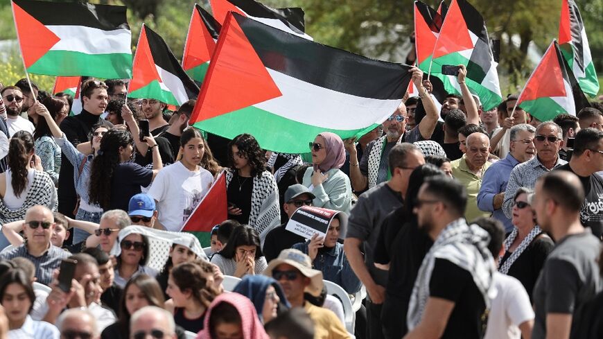 Arab citizens of Israel wave Palestinian flags as they demonstrate for an end to the Gaza war at the annual Land Day protest, this year in northern Israel