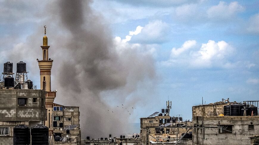 A smoke plume erupts during Israeli bombardment in Rafah, the southern Gaza Strip, where world leaders have warned against an Israeli ground operation 