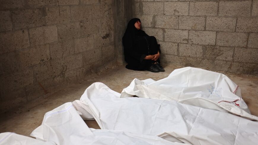 A Palestinian woman mourns relatives killed in Israeli bombardment, at the al-Najjar hospital in Rafah in the southern Gaza Strip, on April 29, 2024 