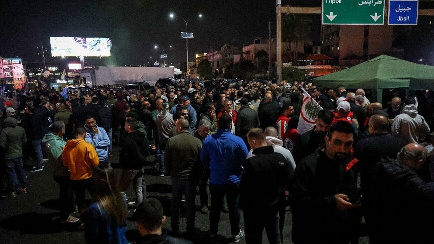 Supporters of the Lebanese Forces block the main Byblos-Beirut highway in protest at the abduction and killing of the Christian party's coordinator for the Byblos area