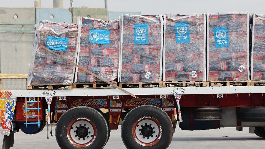 A truck carrying humanitarian aid slated for Gaza awaits clearance at an Israeli crossing