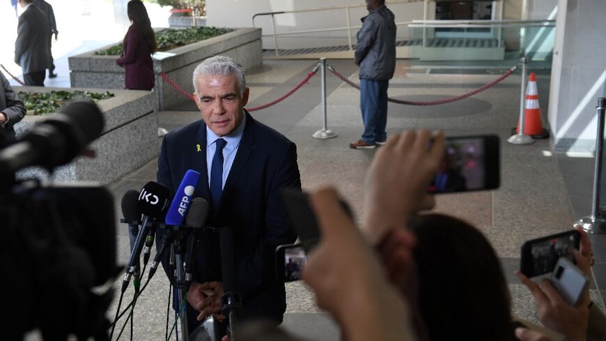 Israeli opposition leader Yair Lapid speaks to reporters after meeting with US Secretary of State Antony Blinken at the State Department 