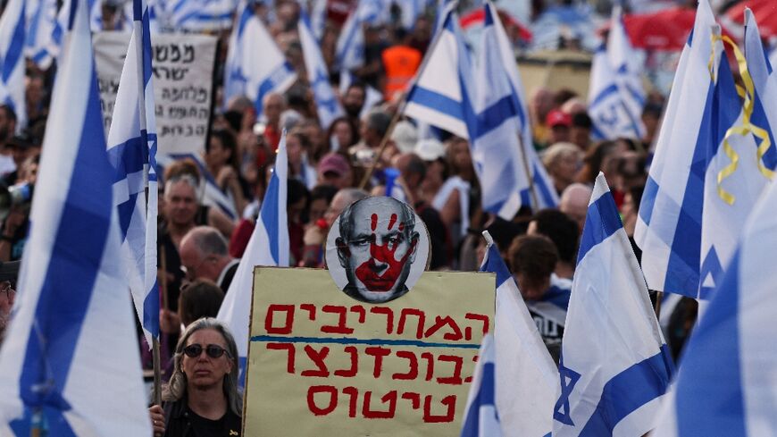 Israeli anti-government protesters rally in front of parliament demanding premier Benjamin Netanyahu resign