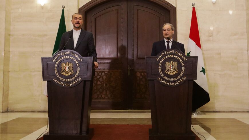 Syria's Foreign Minister Faisal Mekdad (R) and his Iranian counterpart, Hossein Amir-Abdollahian, talk to reporters at the Foreign Ministry in Damascus on Feb. 11, 2024. 