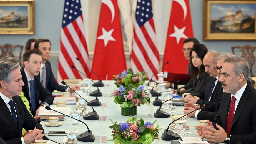 US Secretary of State Antony Blinken (L) takes part in a meeting with Turkey's Foreign Minister Hakan Fidan (R).