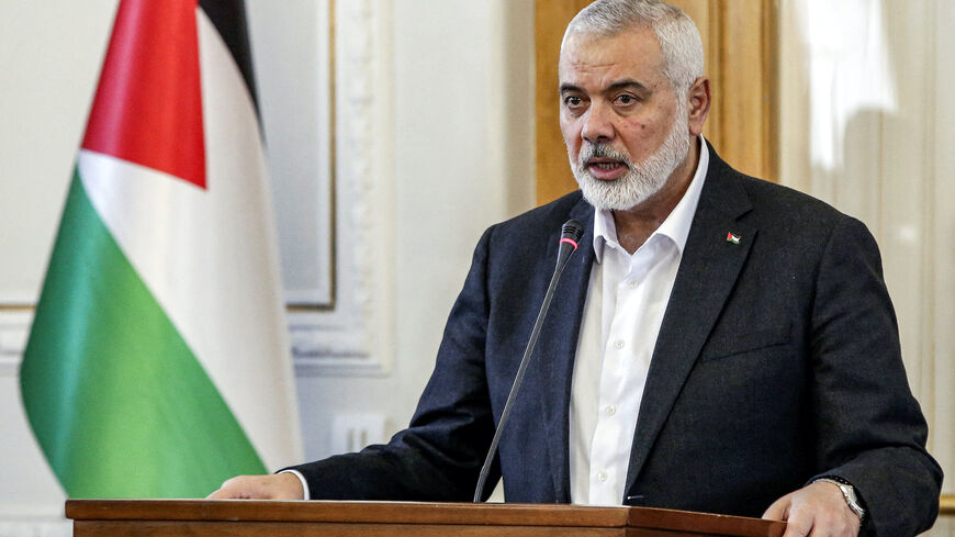 Ismail Haniyeh, the Doha-based political bureau chief of the Palestinian Islamist movement Hamas, speaks to the press after a meeting with the Iranian foreign minister in Tehran on March 26, 2024. 